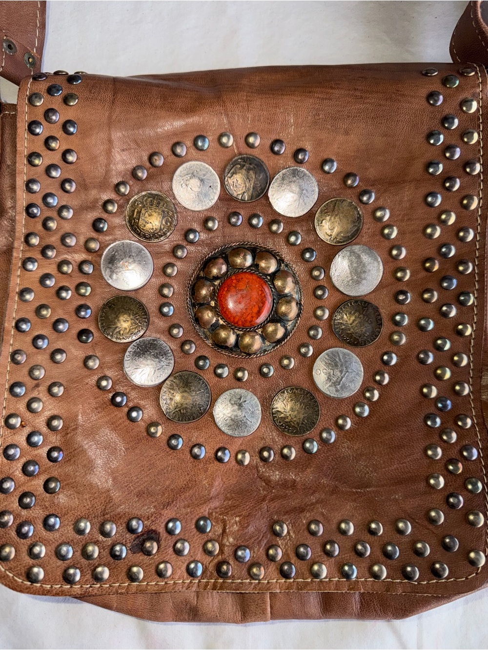 Brown Studded Leather Crossbody Bag with Decorative Medallion